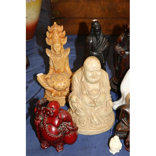 131 - Three Chinese carved hardwood figures and other oriental Buddha and scholar figurines, largest 27cm ... 