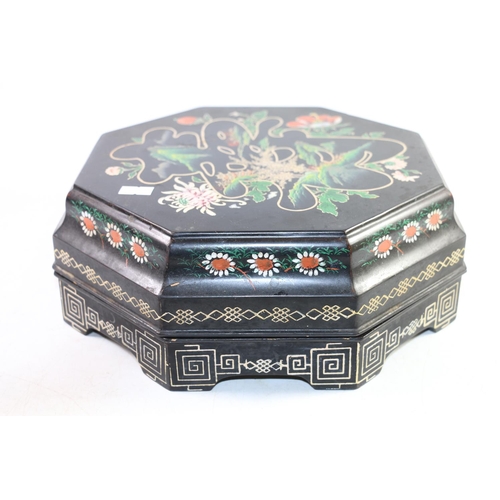 132 - Japanese black lacquer table box opening to reveal segmented red lacquer sections, 28cm wide.