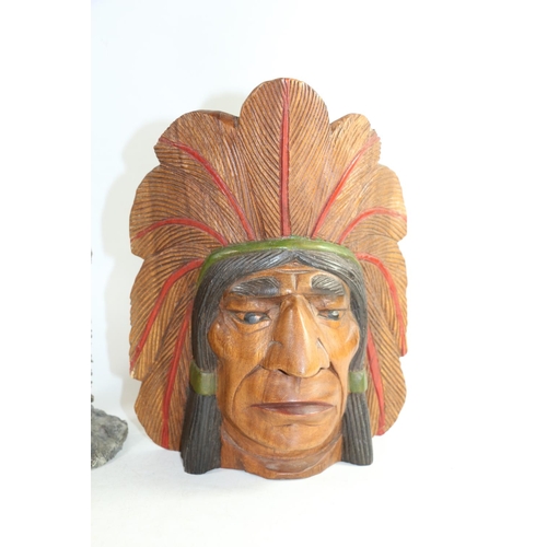 134 - Carved wooden mask of a Native American Chief, 30cm high.