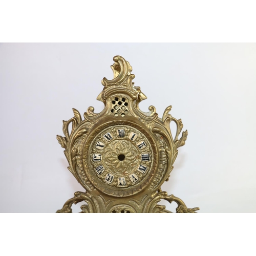 143 - Reproduction French brass mantel clock, 32cm.