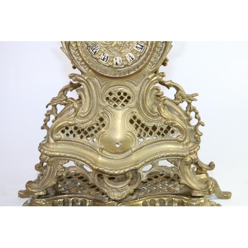 143 - Reproduction French brass mantel clock, 32cm.