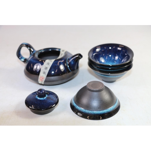 145 - Japanese blue drip glazed porcelain miniature teapot and a matching set of four tea bowls, in origin... 