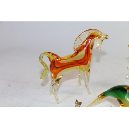 147 - Murano models of a fish, a dolphin and two other glass animals, largest 14cm high.