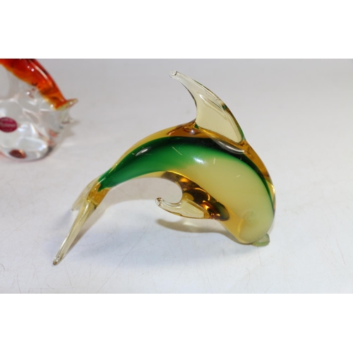 147 - Murano models of a fish, a dolphin and two other glass animals, largest 14cm high.