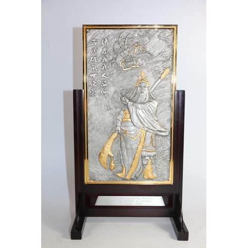 148 - Royal Selangor pewter plaque depicting a Chinese Immortal with calligraphy script to rear, in hardwo... 