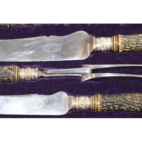 150 - Late 19th century carving set by Duncan and Scobbie, Sheffield, with horn effect handles and silver ... 