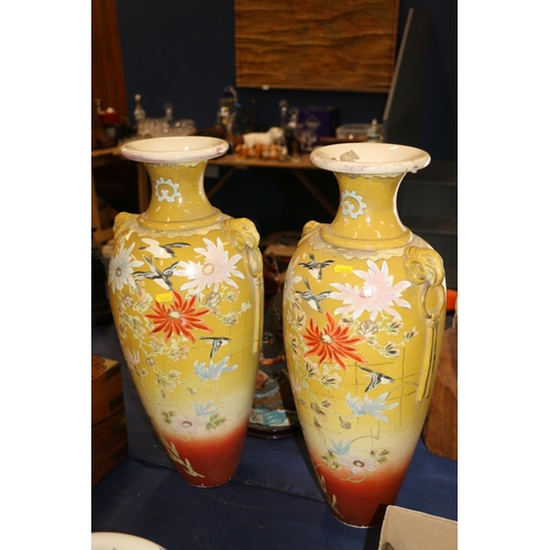 151 - Pair of large continental pottery vases decorated in a chinoiserie style, 56cm high.