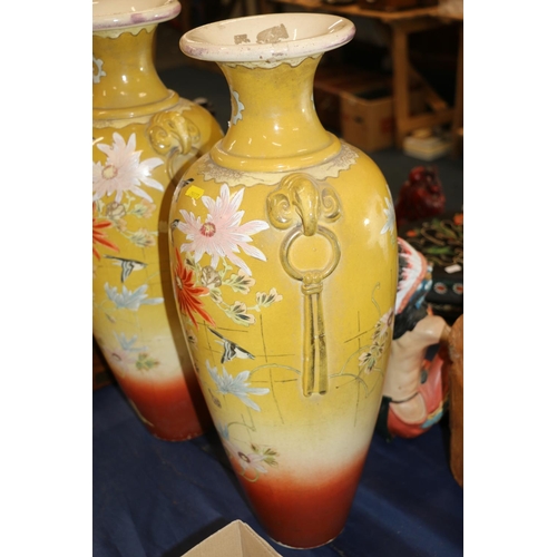 151 - Pair of large continental pottery vases decorated in a chinoiserie style, 56cm high.