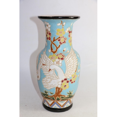 160 - Continental sgraffito decorated with swans and flora pottery vase, 30cm.