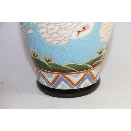 160 - Continental sgraffito decorated with swans and flora pottery vase, 30cm.