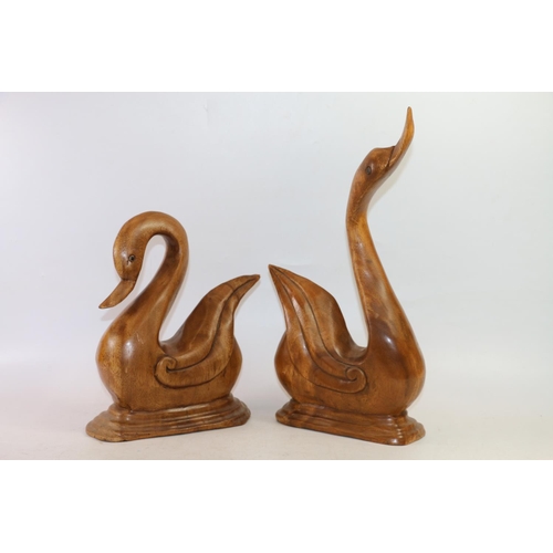 75 - Two carved treen birds and two carved treen antelopes, largest 43cm high.  (4)