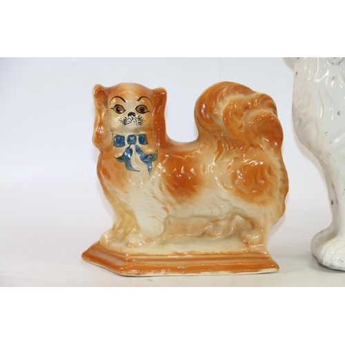 76 - Pair of Staffordshire style fire dogs and a wally dog, 30cm high.