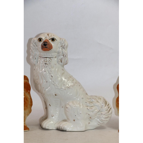 76 - Pair of Staffordshire style fire dogs and a wally dog, 30cm high.