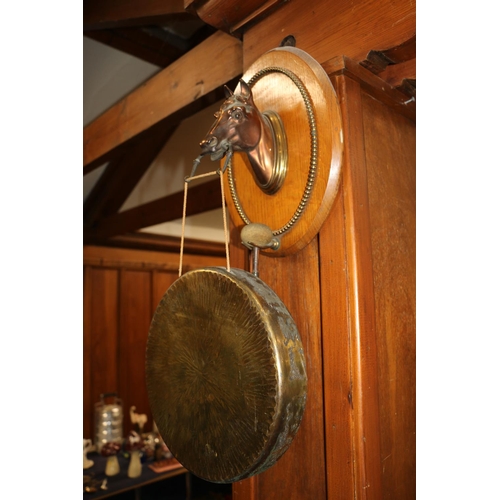 9 - Dinner gong mounted on an oak plaque held with horsehead.
