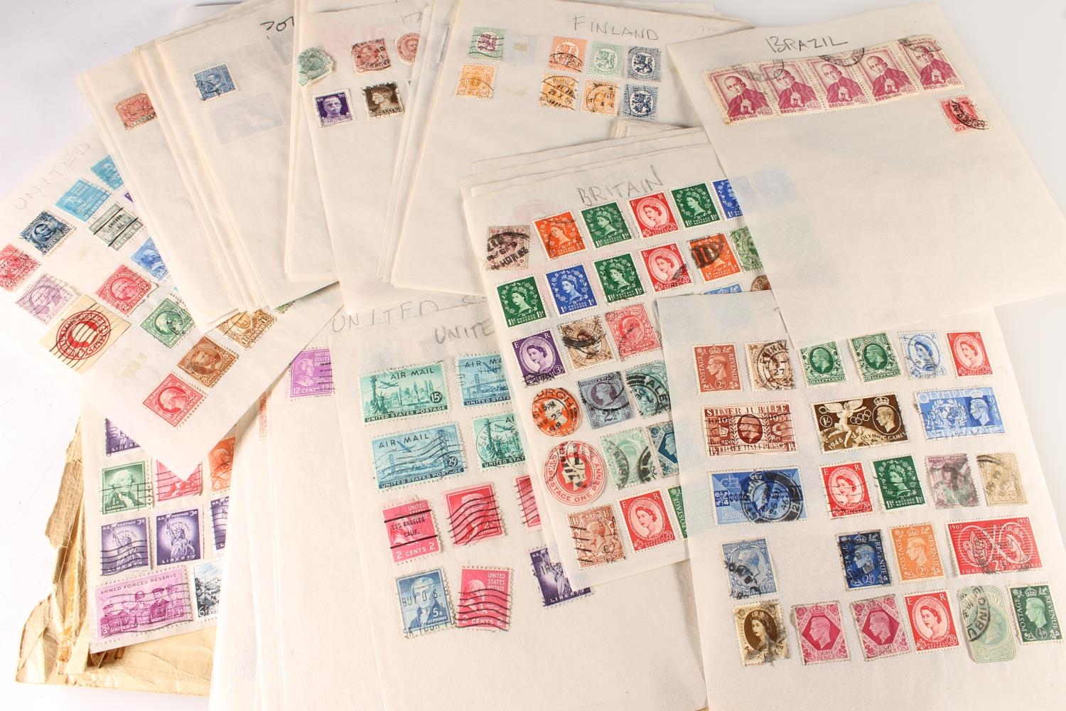 Stamp collection on loose tracing paper sheets to include America