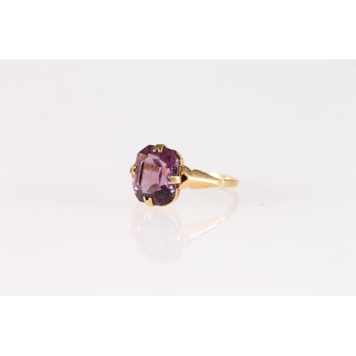 514 - Antique gold dress ring set with amethyst, ring size N, 2.0g gross.