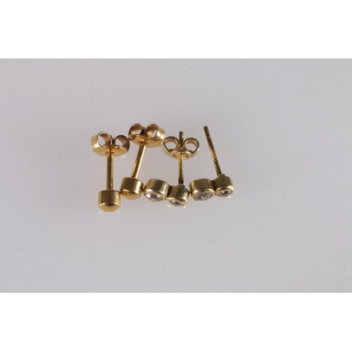 521 - Pair of yellow metal earrings sets with two diamonds, the butterfly stamped '750', 1.5g gross and an... 