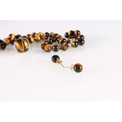 523 - South African Sterling silver tigers eye ring, a similar neck chain and pair of matching earrings.