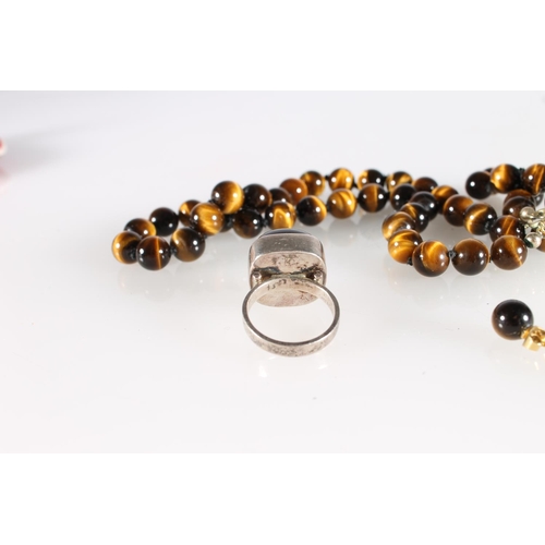 523 - South African Sterling silver tigers eye ring, a similar neck chain and pair of matching earrings.