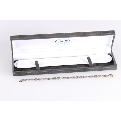 547 - 9ct gold tennis bracelet set with small diamonds and multicoloured semi-precious stones, 9.6g gross,... 