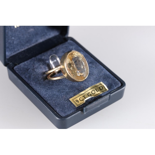 550 - Scottish 9ct gold dress ring set with oval citrine by Malcolm Gray of Ortak, 4.6g.