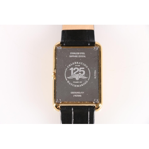 561 - Gents Rotary Cambridge wristwatch, commemorative issue celebrating 125 years of Rotary, on black lea... 