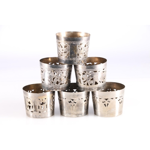 578 - Harlequin set of six Indian plated beaker holders with Elephant and pierced decoration.