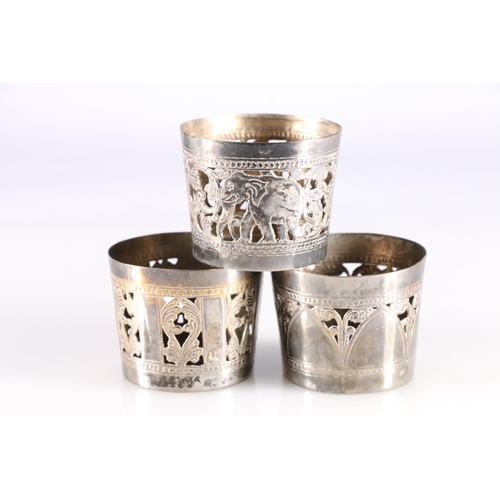 578 - Harlequin set of six Indian plated beaker holders with Elephant and pierced decoration.