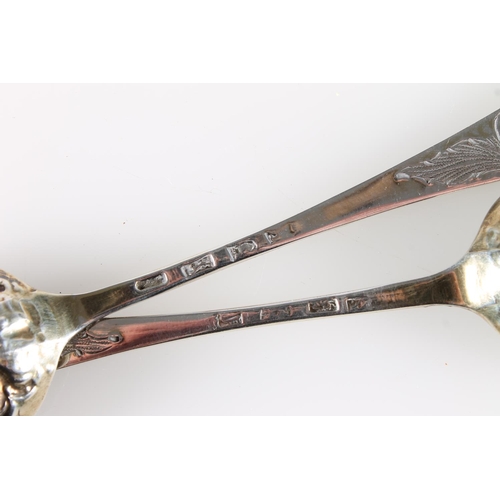 587 - Pair of Georgian silver berry serving spoons with mask and grape vine decoration, 94g.