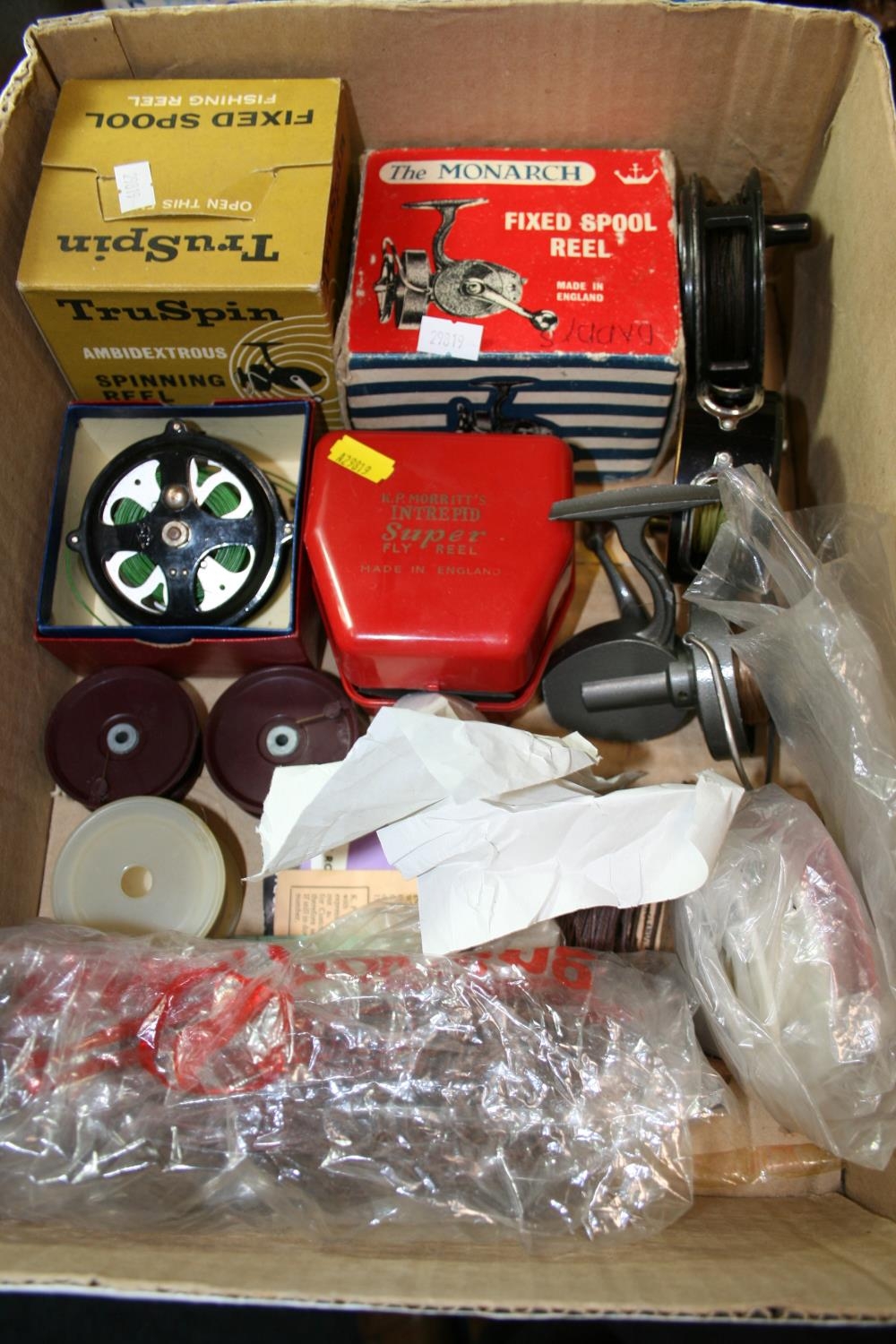 Box containing fishing reels to include Intrepid Super Fly Reel
