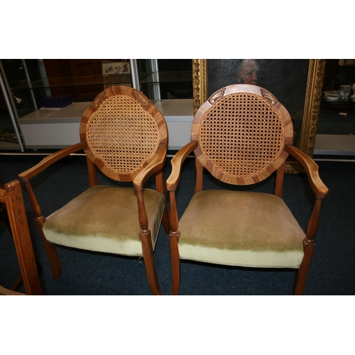 748 - Pair of bergère backed armchairs with green upholstered seats.