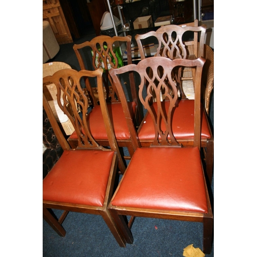 752 - Set of four Chippendale style mahogany dining chairs with pierced splats and burgundy leather seats.