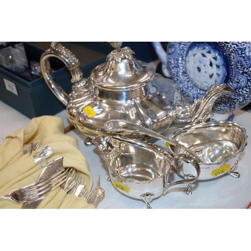 168 - Silver-plate to include a Rococo style teapot, a milk jug, flatware etc.