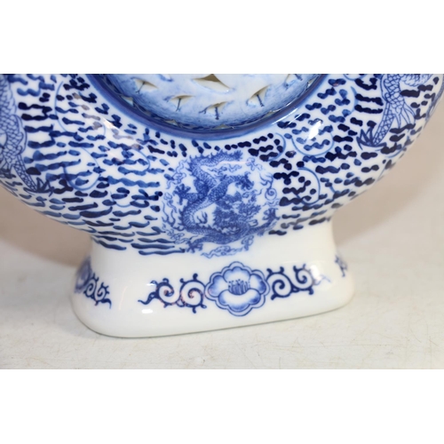 169 - 20th century Chinese style moon shape underglaze blue and white teapot with dragon handle decorated ... 