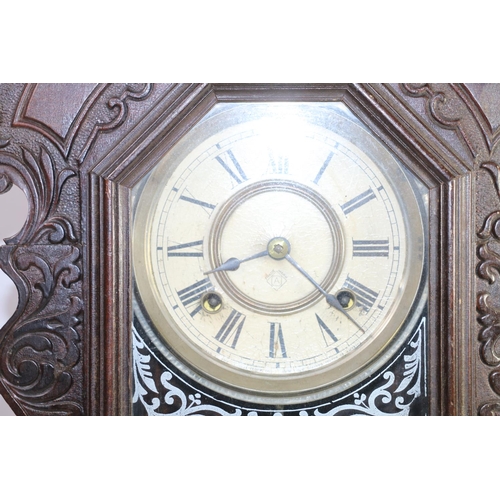 170 - American wooden framed wall clock with glazed front, 57cm high.