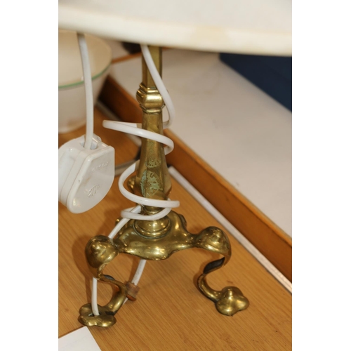 188 - Brass Arts & Crafts style table lamp on three pad feet, with later shade.