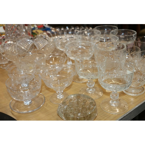 190 - Suite of glassware to include a water jug, cut-glass table bowls, sundae dishes, etc.