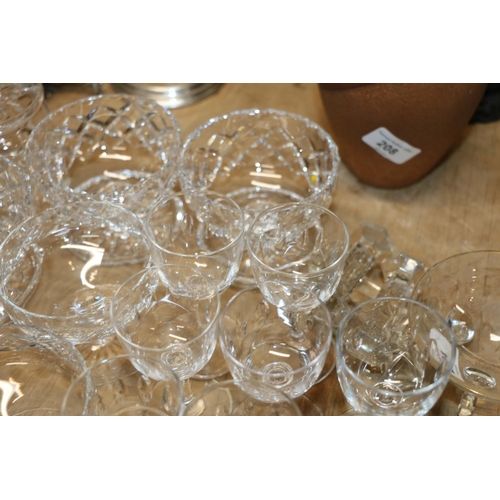 204 - A collection of cut glass to include cut-glass sundae dishes, a preserve dish, etc.