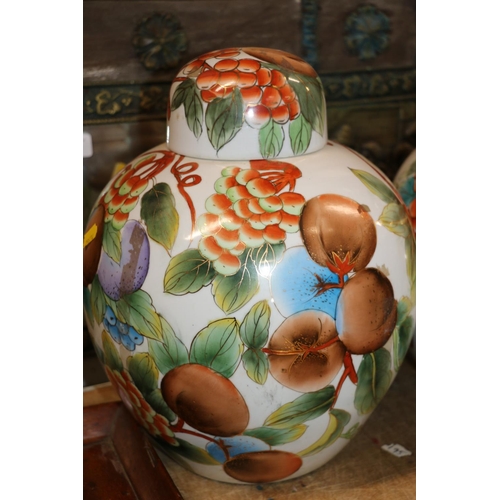 216 - Pair of 20th century jars and covers decorated with fruit, 32cm.