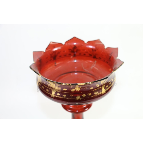 219 - Bohemian ruby glass table lustre with gilt decoration, 34cm.