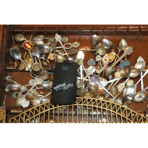 229 - Silver-plate and enamel souvenir spoons, and hanging rack.