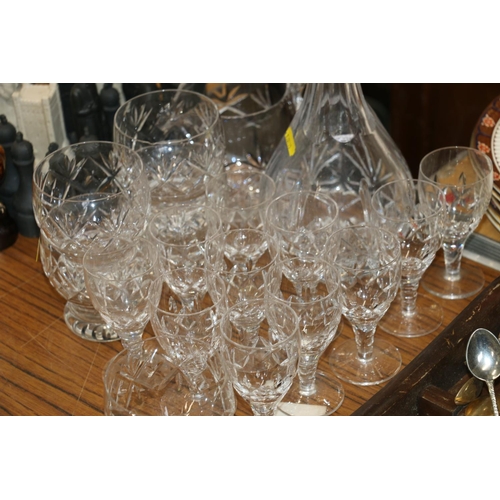 231 - Suite of glassware to include a decanter, a water jug, brandy glasses, etc.