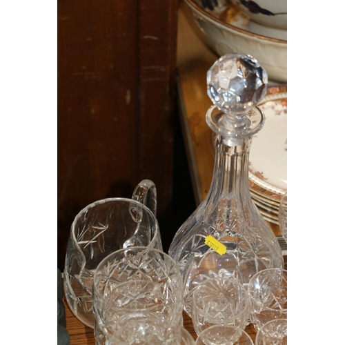 231 - Suite of glassware to include a decanter, a water jug, brandy glasses, etc.