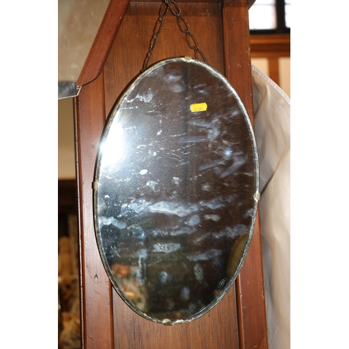 243 - Art Deco style wall mirror and an oval mirror.