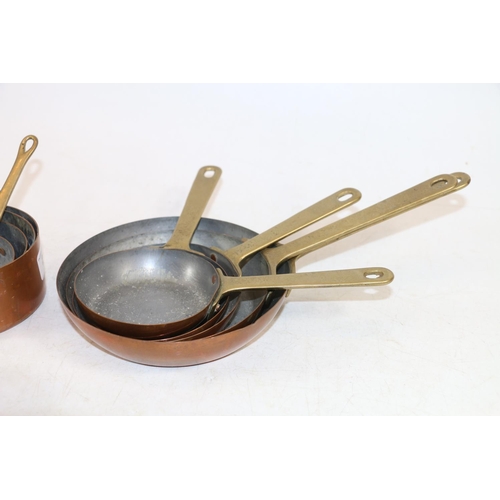 247 - Graduated sets of small brass and copper kitchen pan measures.