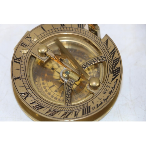 249 - Reproduction brass compass and a 19th century wooden framed photography plate.