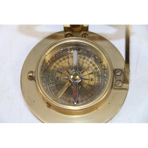 249 - Reproduction brass compass and a 19th century wooden framed photography plate.