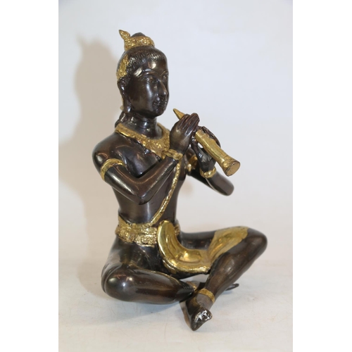 251 - South East Asian heavy cast metal model of a snake charmer, 19cm.