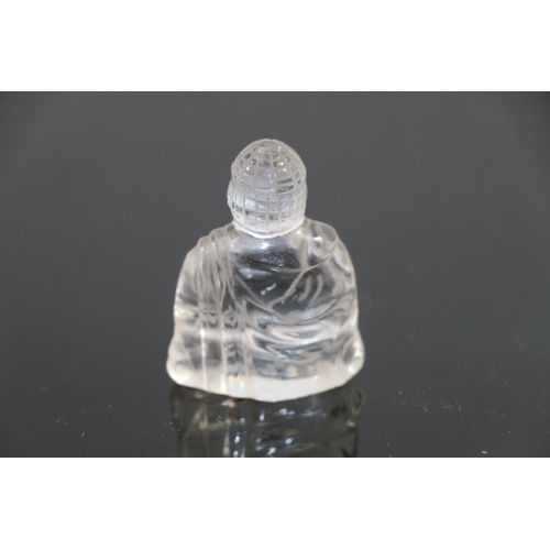 252 - Small oriental carved glass figure of a Buddha.