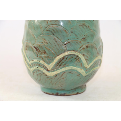 281 - Studio Pottery vase with flared rim and wave form decoration in blue/green glaze, 25cm high.